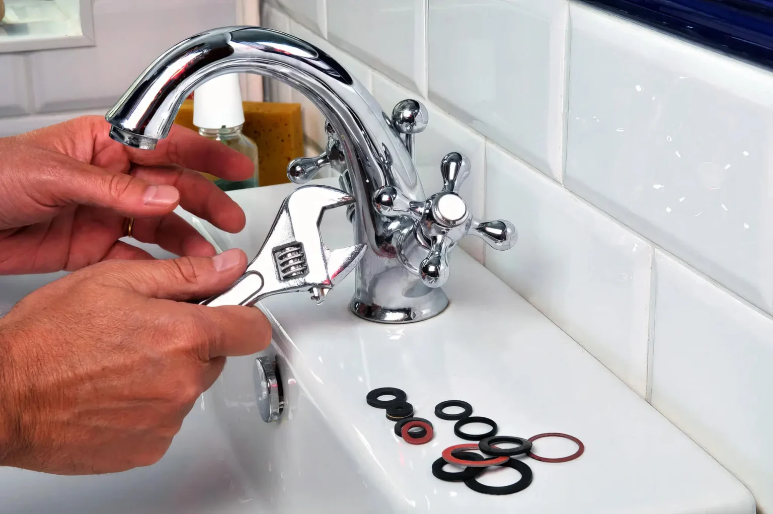Plumber maintaining a bathroom faucet in West Sacramento
