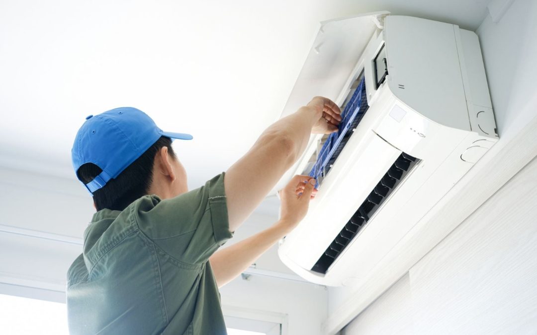 HVAC technician servicing a ductless mini split in West Sacramento