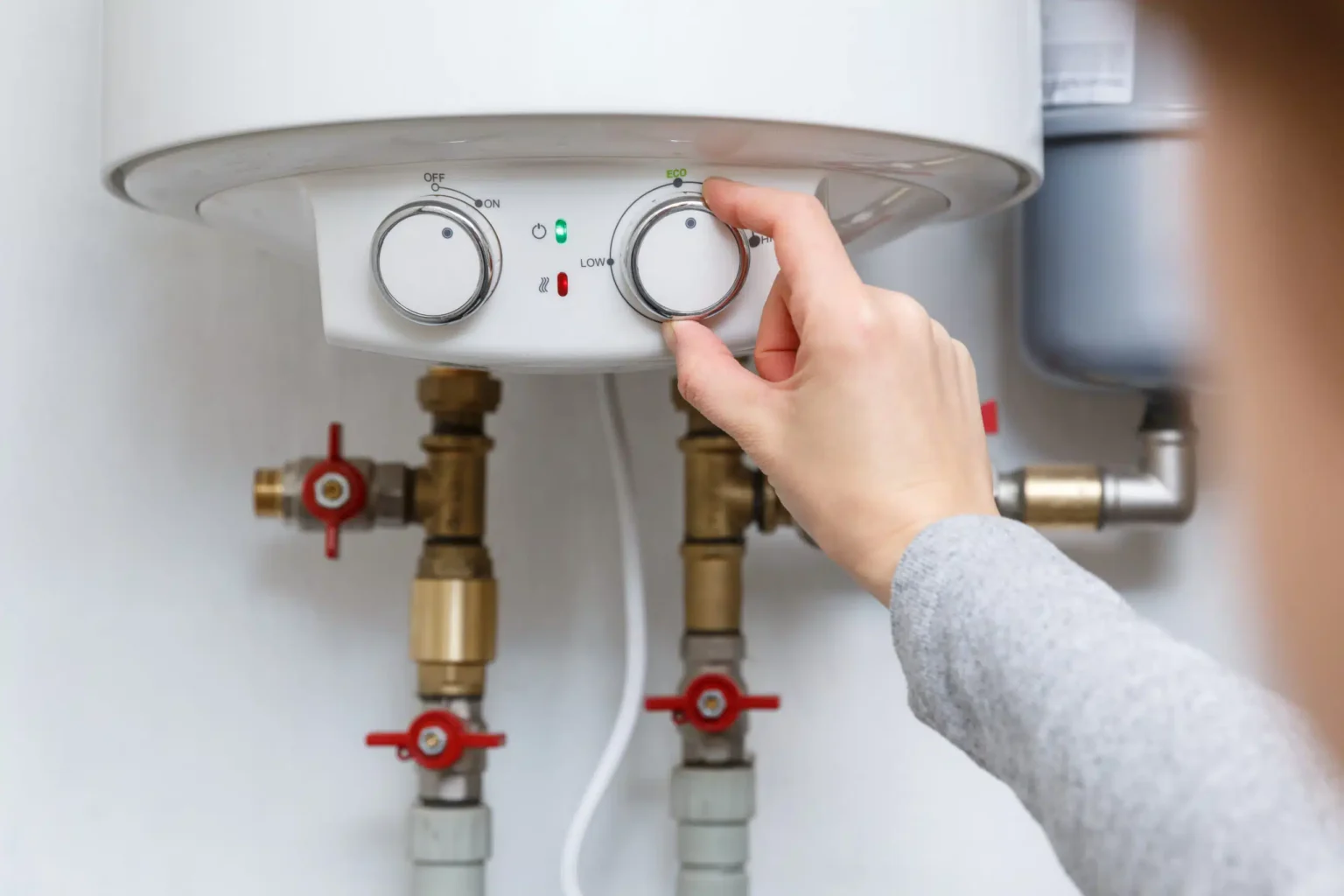 Technician adjusting a water heater in West Sacramento